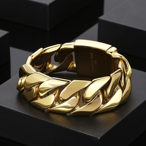 Close-up of 24mm gold cuban link bracelet on black display box showing 316L stamp