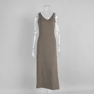 Detail of slim fit brown knitted maxi dress featuring a V-neck and delicate straps