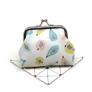 Detailed macro view of retro kiss-lock coin purse with fruit prints and silver metal clasp