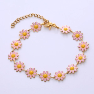 Detail of pink enamel daisy flower bracelet with adjustable golden chain and lobster clasp