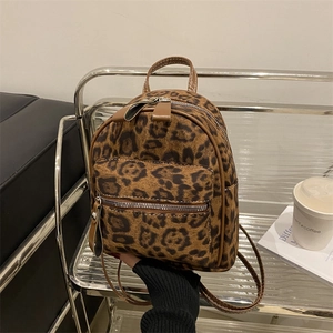 Mini leopard print backpack for women with brown faux fur and gold zipper detail