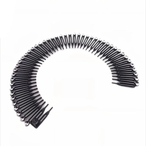 Detail of stretchable black hair comb with sparkling rhinestones for hair styling