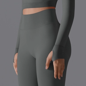 Detail of charcoal grey ribbed yoga set featuring thumbholes and high waist texture