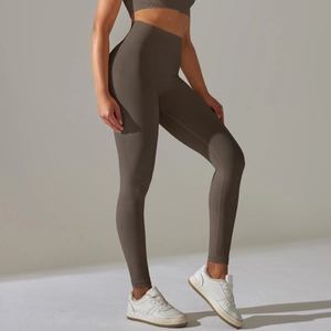 Detail of high-waisted seamless ribbed leggings with contouring fit in earth tone