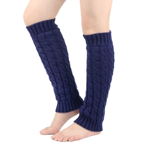 Detailed close-up of blue cable knit leg warmers showing the soft braided texture and weave