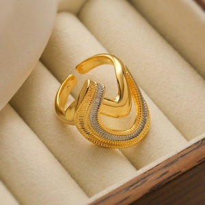 Minimalist two-tone irregular geometric open ring with gold and silver polished metal finish
