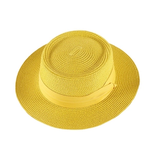Fashionable yellow woven straw sun hat with ribbon band and wide flat brim for summer