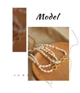 Detail of freshwater pearl bracelet with a crystal-encrusted infinity symbol on silk