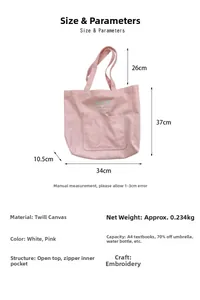 Detail view of pink canvas tote bag showing dimensions and embroidered bow pattern