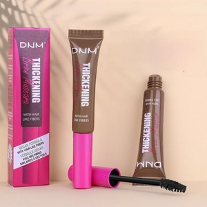 Macro view of waterproof eyebrow mascara with fibers and vegan formula in pink packaging