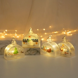 Detail of Christmas LED lantern showing Snowman and Santa motifs in warm glowing light