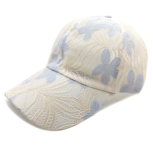 Detailed close-up of light blue lace embroidery on a breathable floral baseball cap