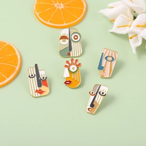 Artistic abstract mask enamel pin set with geometric faces for clothing and bags