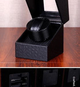 Detail of single watch winder battery compartment and DC power port with carbon fiber interior