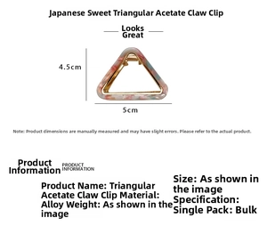 Detailed view of triangle acetate hair claw clip with dimensions 4.5cm by 5cm in gold frame