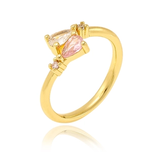Macro detail of gold plated ring featuring pear-cut pink and round clear zircon stones