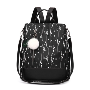 Floral oxford cloth backpack for women with white plant prints and plush ball pendant