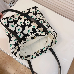 Internal view of floral cotton tote bag showing secure metal magnetic snap closures