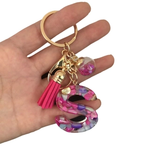 Pink and purple glitter resin letter S keychain with gold ring and pink tassel