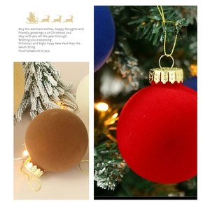 Close-up of velvet 8cm Christmas balls with gold ornate caps and hanging strings