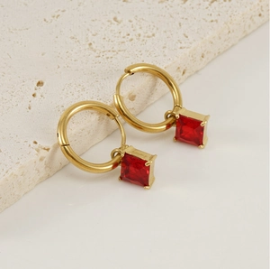 Detail of 18K gold-plated stainless steel hoop earrings with red square zircon pendant