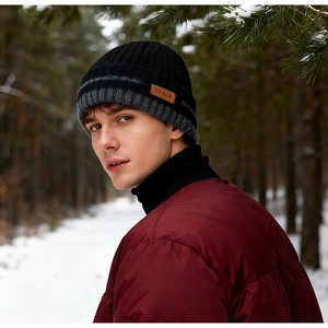 Winter knit beanie with fleece lining, leather tag detail and dark grey stripe pattern