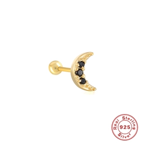 Close-up of golden crescent moon stud earring in S925 silver with a black gemstone