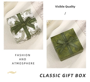 Detail of vintage jewelry gift boxes with paisley patterns and decorative bow ribbons