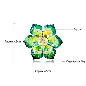 Detail shot of green and yellow crystal flower brooch measuring 4.5cm with 18g weight