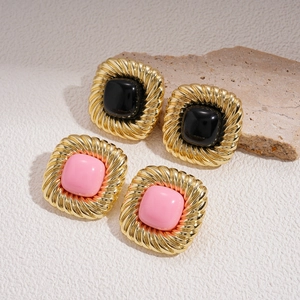Retro geometric square earrings in gold with black and pink resin inserts