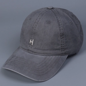 Close-up of vintage dark grey washed cotton baseball cap with white H letter embroidery