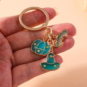 Halloween keychain with enamel pumpkin, witch hat and bat charms on golden ring