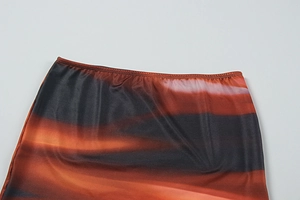 Macro view of elastic waistband with vibrant abstract digital print on fashion skirt