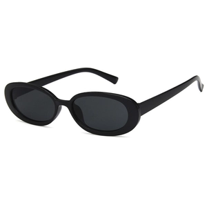 Retro oval black sunglasses for women with a vintage 90s street fashion aesthetic