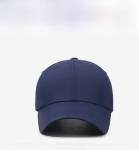 Close-up of quick-dry navy blue baseball cap with reinforced stitching on curved brim