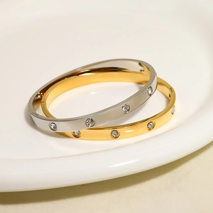 Polished titanium steel bracelets with cubic zirconia stones in gold and silver finish