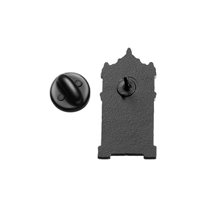 Close-up of black enamel building silhouette brooch with secure rubber back fastener