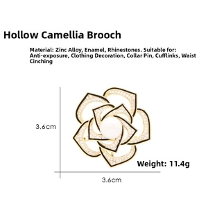 Detailed view of hollow camellia brooch with rhinestones, pearl, and black oil trim