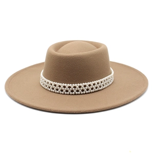 Close-up of camel wool felt hat featuring a decorative white pearl woven hatband