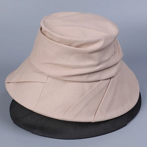Detail view of cotton linen sun hats featuring tiered brims in beige and black colors