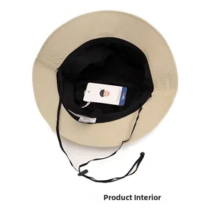 Detail view of the beige sun hat interior with black mesh lining and adjustable chin strap