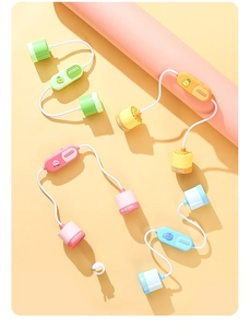Detail of portable neck fans in multiple macaron colors with fruit icons and flexible bands