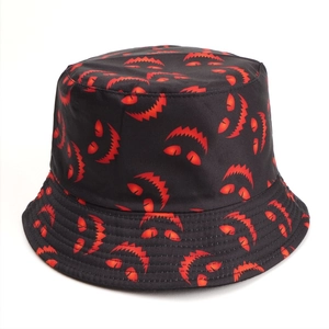 Close-up of the detailed stitching on the brim and red monster print on a black bucket hat