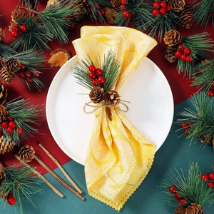 Elegant yellow jacquard fabric napkin with pine cone ring for Christmas table decor