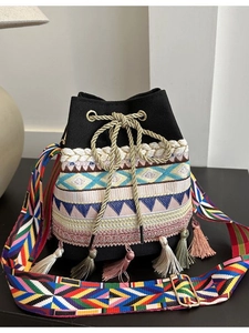 Ethnic bohemian canvas bucket bag with colorful embroidery and tassel details