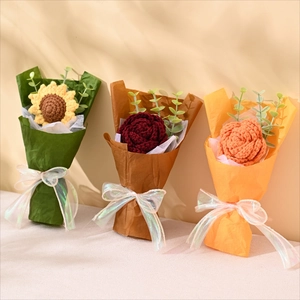 Detailed view of handmade crochet sunflower and rose bouquet with elegant gift wrapping