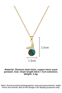 Detailed view of mermaid tail necklace with blue sphere and dimensions 2.5x1.2cm