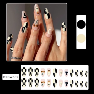 Detail of Halloween almond nails featuring ghosts, pumpkins and wizard hat patterns