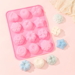 Pink 12-cavity silicone mold featuring detailed floral and geometric patterns for DIY desserts