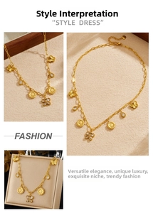 Detail of gold plated butterfly and sunflower charms on a stainless steel necklace